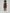 Person wearing a brown bodysuit on a plain background